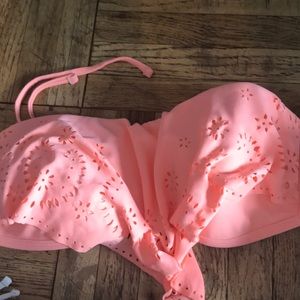 Orange/pink bikini with a patterned float overlay.